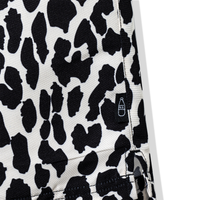 Close-up of 40s & Shorties bottle logo tag on leopard print shorts
