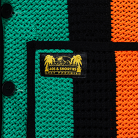 Close-up of pocket label – Yellow and black woven "40s & Shorties Lost Paradise" label stitched above the right pocket.
