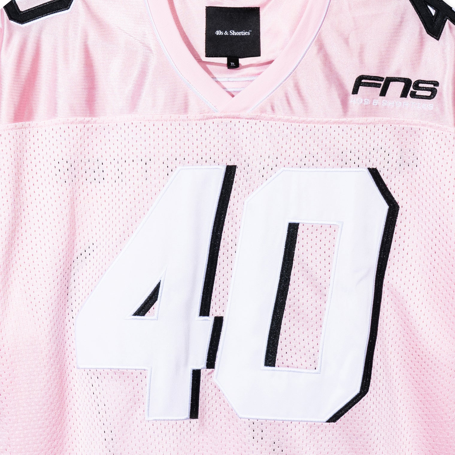 Close-up of front “40” appliqué and FNS chest embroidery on the Pink Fubar Jersey by 40s & Shorties.
