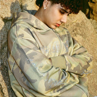 Close-up of 40s & Shorties Angel Wings Hoodie in camo with rhinestone artwork detail on sleeves and chest.