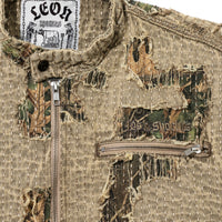 Close-up of Boro Jacket chest showing distressed boro stitching, camo under-layer, and 40s & Shorties embroidery
