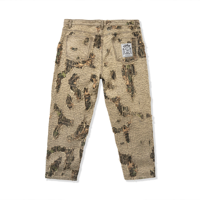 Back view of Boro Pants showing full boro-style stitching, hand-torn detailing, and tree camo under-layer
