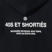 Detailed view of printed “40S ET SHORTIÉS” graphic with French text on back of black hoodie – 40s & Shorties.
