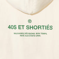 Detailed view of printed “40S ET SHORTIÉS” graphic with French text on back of cream hoodie – 40s & Shorties.

