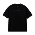 Front product shot of Leon General Logo Tee in black with minimalist puff print

