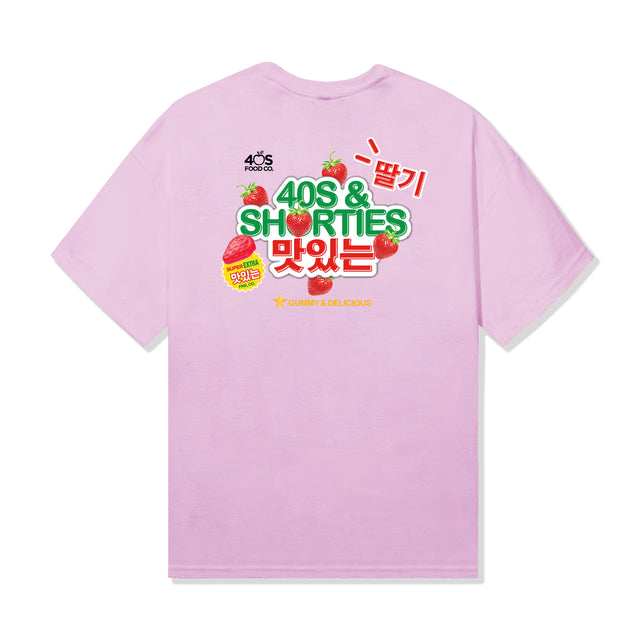 Back of pink cotton tee with large "40s & Shorties" strawberry graphic and bold Korean characters, inspired by gummy candy packaging.