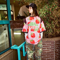 Lifestyle shot of a model wearing the Gummy Soccer Jersey with camo pants

