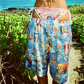 Rear close-up of model wearing Holy Spirit Shorts and bikini set, showing details of artwork and stitching
