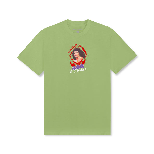 Front view of the Lucious Tee in Pistachio featuring a printed graphic of a woman framed by red lips above a purple and white "40s & Shorties" logo.