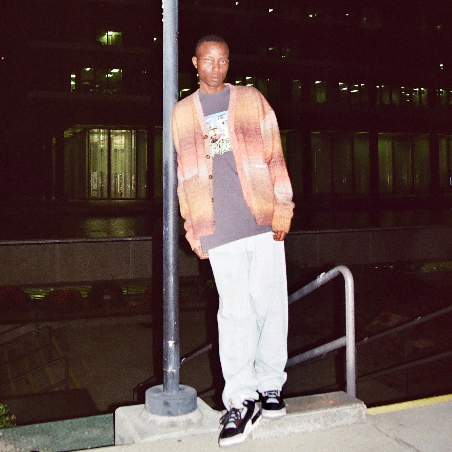 Model wearing the Lithium Cardigan styled with light denim and sneakers