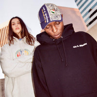 Lifestyle shot of models wearing the OG Text Logo Hoodie in Black by 40s & Shorties
