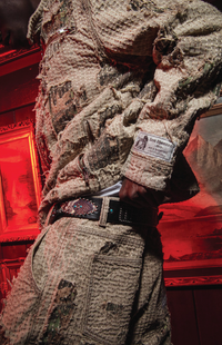 Model wearing matching Boro Jacket and Boro Pants set showing distressed stitching and woven label
