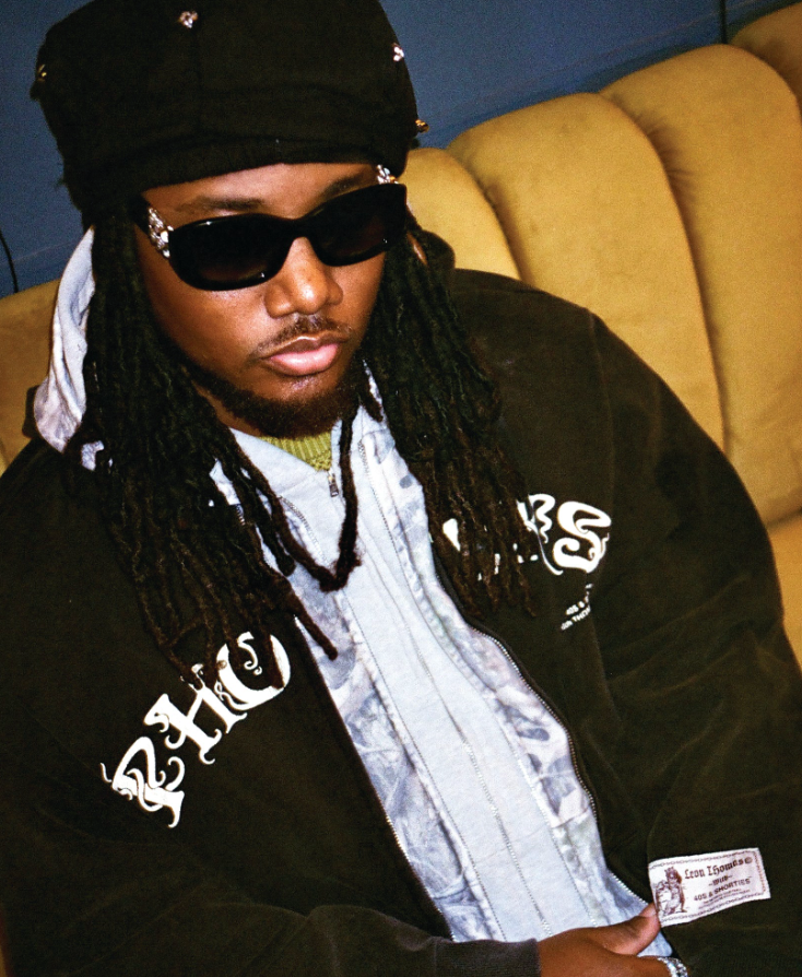 Model wearing Triple Zip Hoodie with layered hoods and cracked front print
