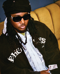 Model wearing Triple Zip Hoodie with layered hoods and cracked front print
