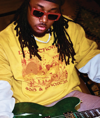 Model wearing Trippy Tee in sand beige with surreal Pholks-inspired artwork
