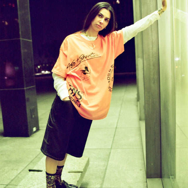 Full fit image of model styling Standard Carpenter Shorts with graphic tee and accessories