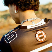 Close-up back view of 40s & Shorties Tales Hockey Jersey showing embroidered neck label and sleeve patch detail.