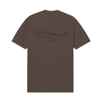 Back view of Wavy General Logo Tee in Brown with large back graphic