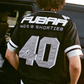 Model showing back view of Fubar Jersey in Black with “FUBAR” and “40” appliqué visible.
