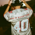 Model showing back view of Fubar Jersey in Grey with “FUBAR” and “40” appliqué visible.
